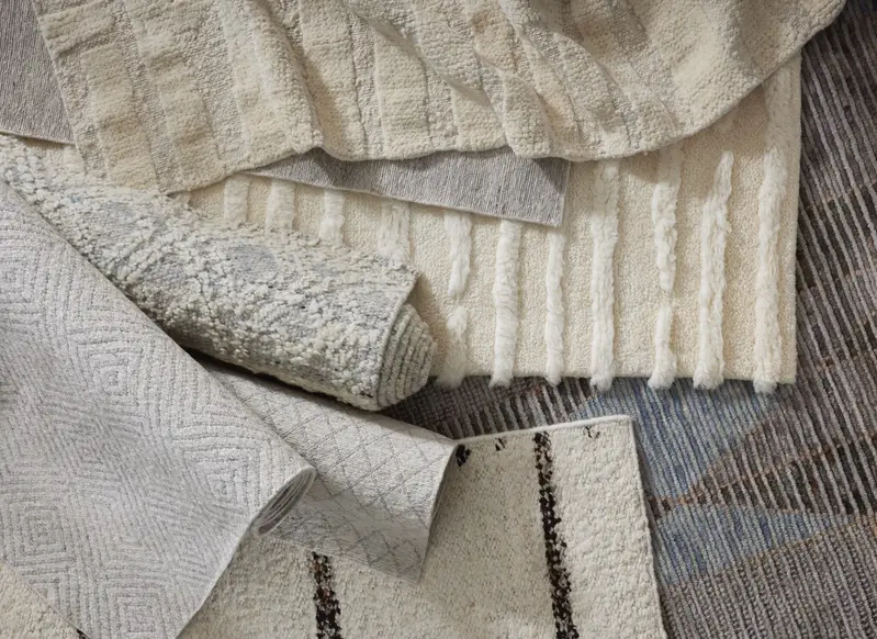 Jara wool carpet from Luxe by Kaleen in a warm cozy room setting with neutral cream and brown decor