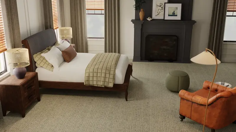 Warm, inviting bedroom with a soft beige carpet and a cozy chair placed in front of a fireplace