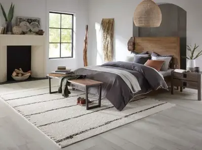 Ivory Wool Rug from the Luxe collection by Kaleen in the master bedroom.