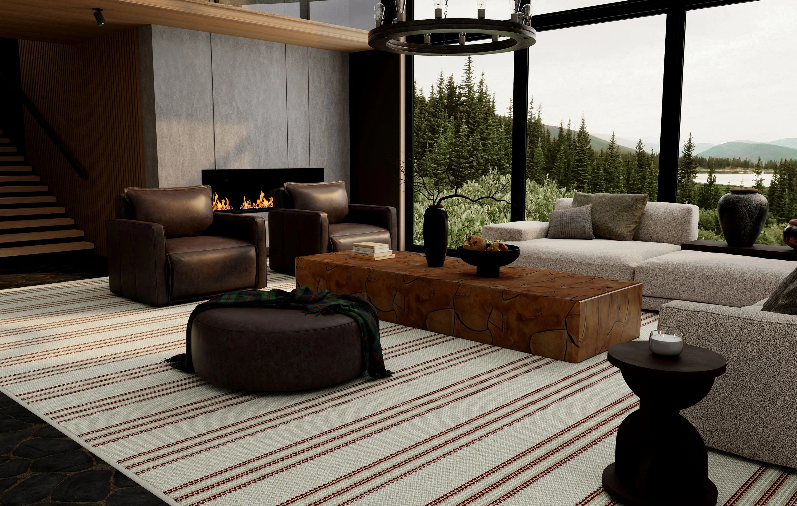 Mountain lodge living room with leather club chairs and a wood coffee table on an Enchantment in Burgundy striped rug beside a modern fireplace