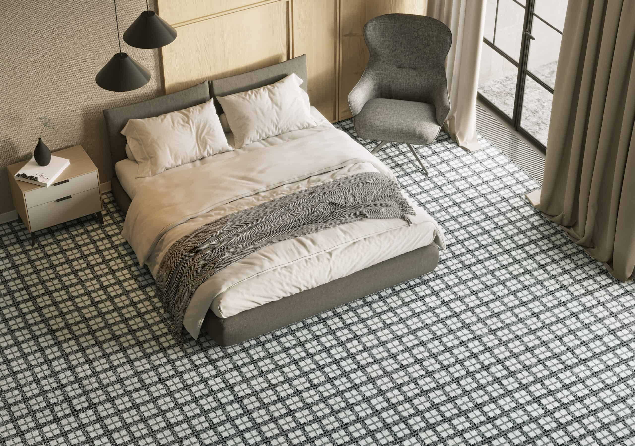 Bold patterned wool carpet from Kaleen creates an inviting bedroom with a minimalist modern decor