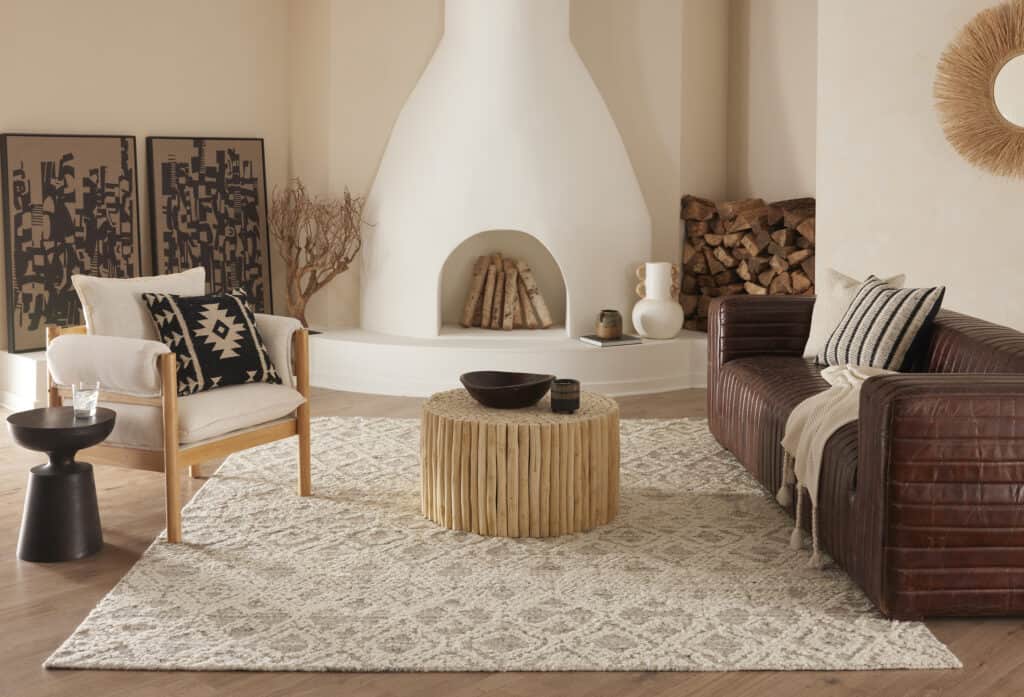 Jara wool carpet from Luxe by Kaleen in a warm cozy room setting with neutral cream and brown decor.