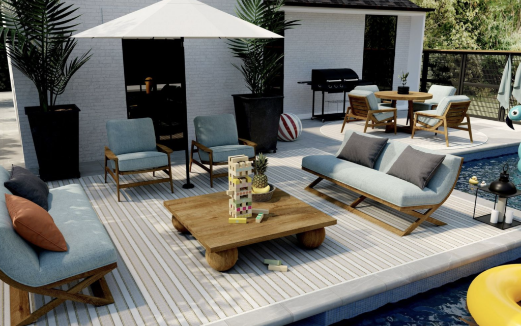 A patterned outdoor rug from the Kaleen Palmetto Dunes Collection anchoring an outdoor seating area, adding personality and a luxurious feel.